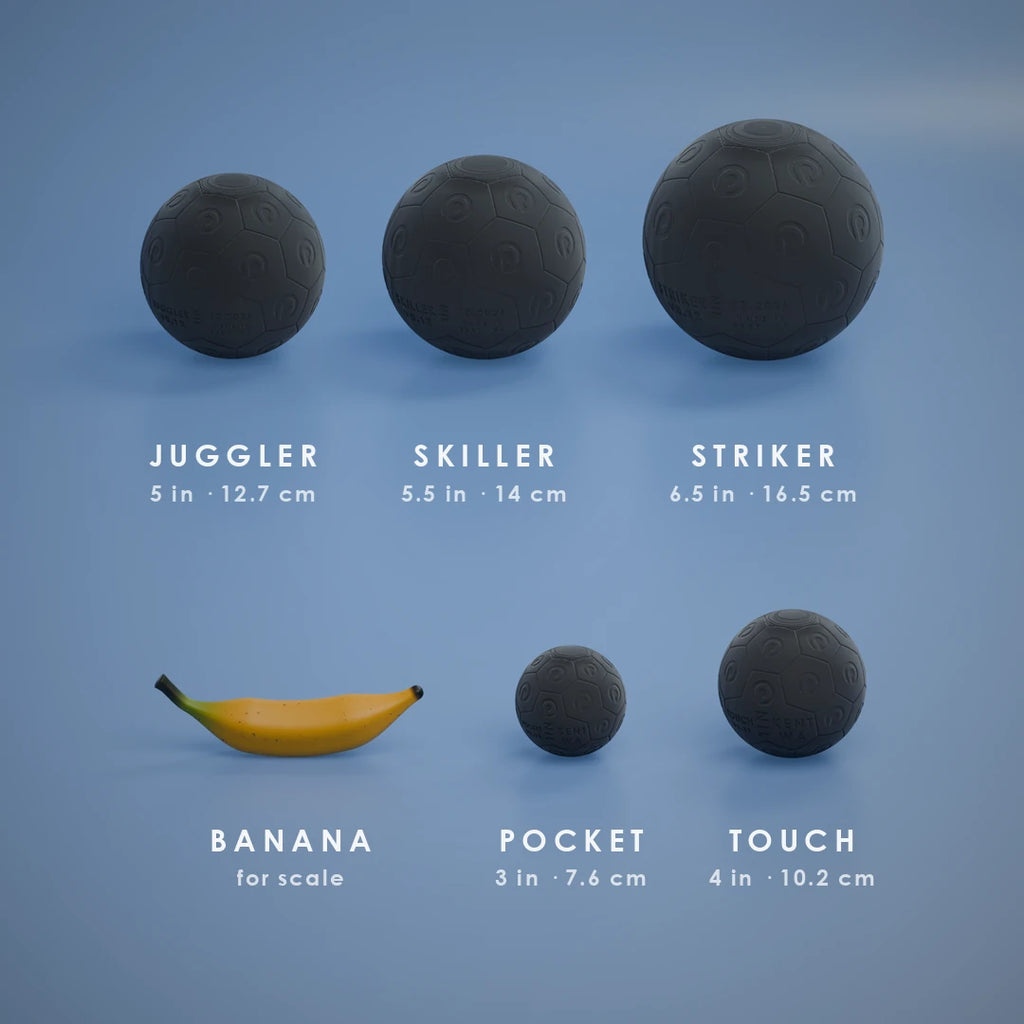 All five Nil Ball sizes in Black at true scale, with a banana for scale