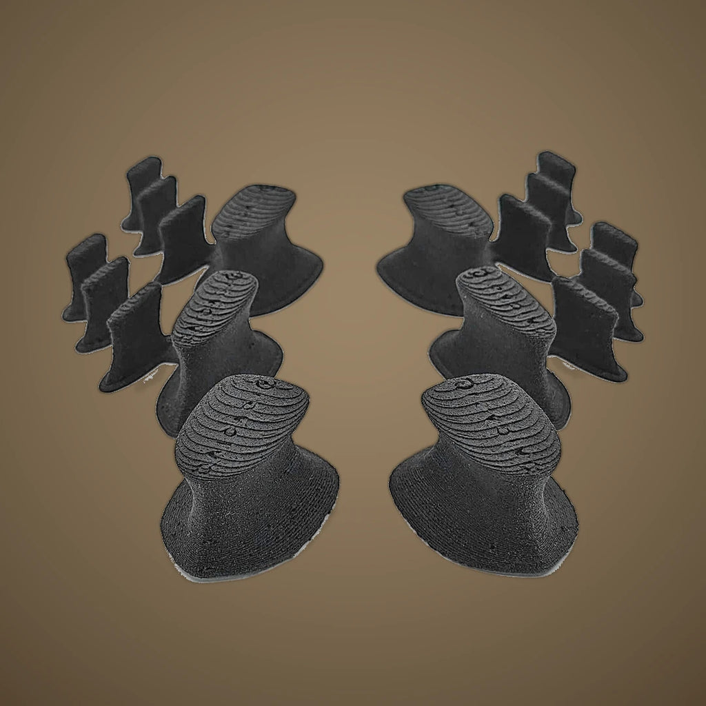Replacement toe spacer pieces, charcoal set on warm oat studio background