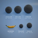 All five Nil Ball sizes in Black at true scale, with a banana for scale