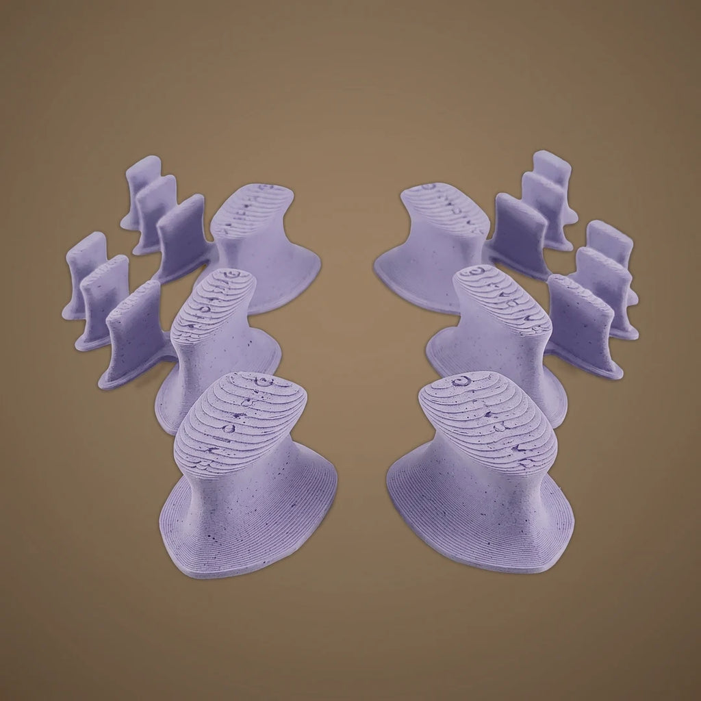 Replacement toe spacer pieces in Lilac on warm oat studio background