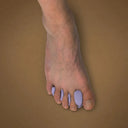 3D Custom Toe Spacers in Lilac worn on foot, showing natural toe splay and alignment